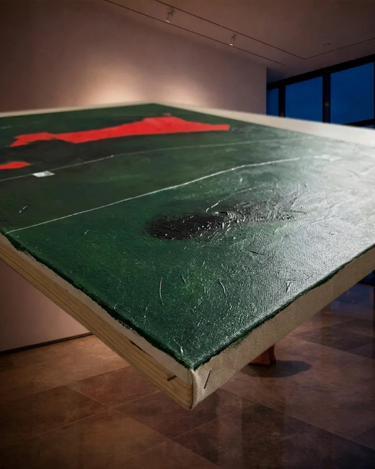 Abstract painting by Maurizio Valch on a wooden stretcher shown at an angle, displaying the dense green texture and horizontal incised lines.
