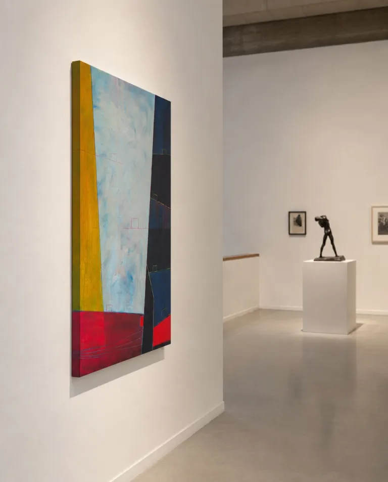 Side view of LIMEN by Maurizio Valch in a gallery room: a vertical painting with an ochre band, veiled pale blue centre, dark blue planes, and a red lower strip.