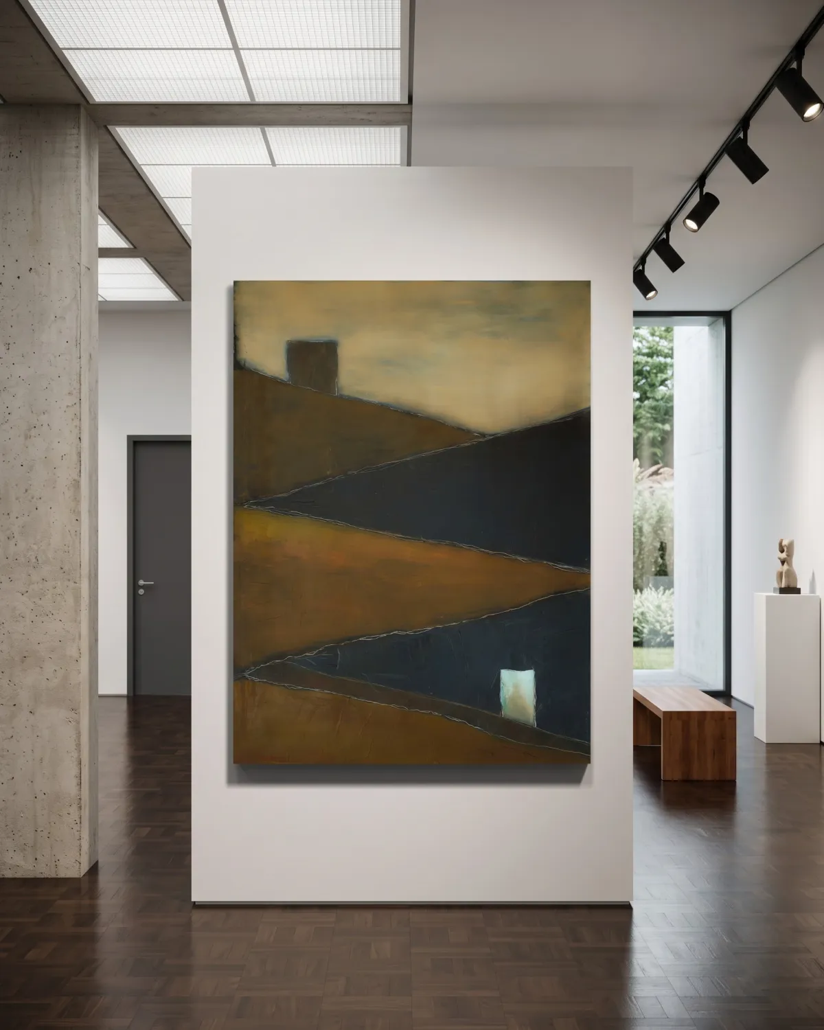 A contemporary art gallery interior displaying a vertical abstract painting titled TENSUM by Maurizio Valch on a central white partition wall. The artwork features diagonal blocks of ochre and dark blue with fine linear incisions and a small bright white rectangle in the lower right corner. The gallery setting includes a raw concrete column on the left, dark wood parquet flooring, a simple wooden bench, and a large window in the background admitting natural light.