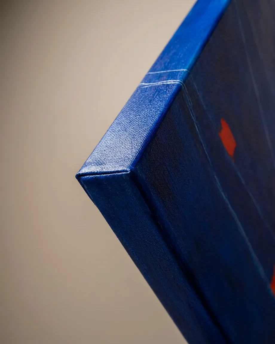 Close-up shot showing the top-left corner of the textured blue canvas from the abstract artwork SUBMERSA by Maurizio Valch.